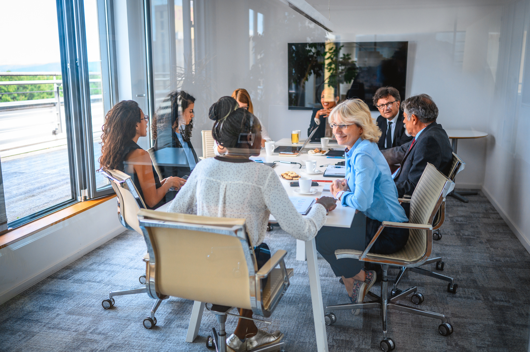 Office Board Room Meeting Photographed Through Window