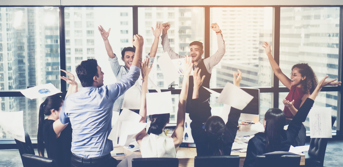 Business Team Celebrating Successful Project in the Office